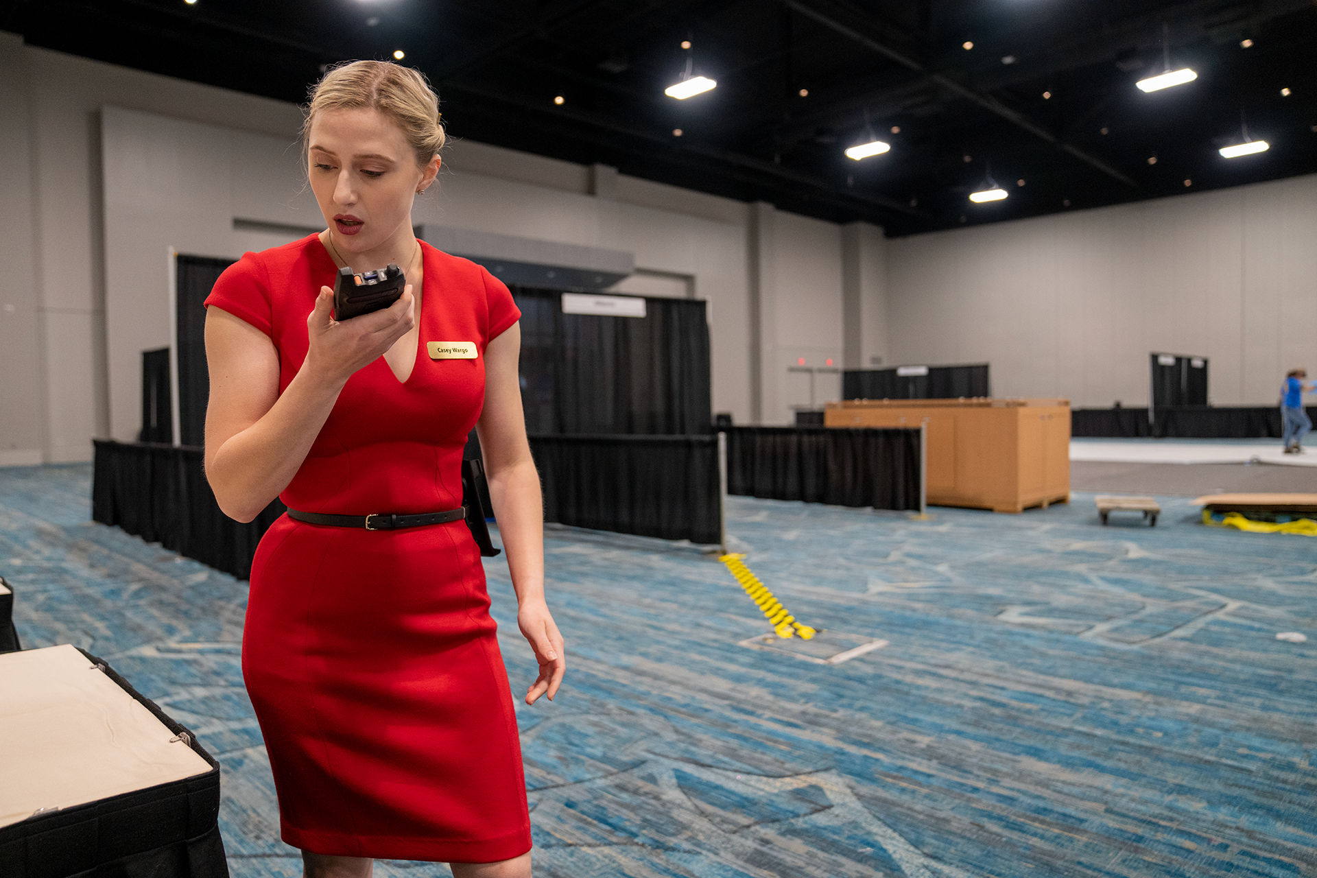 women holding walkie talkie