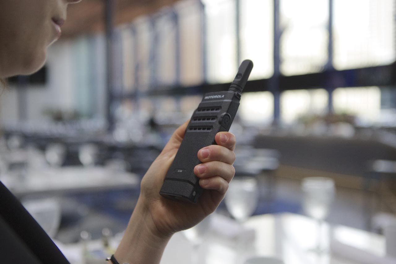 hand holding a walkie talkie