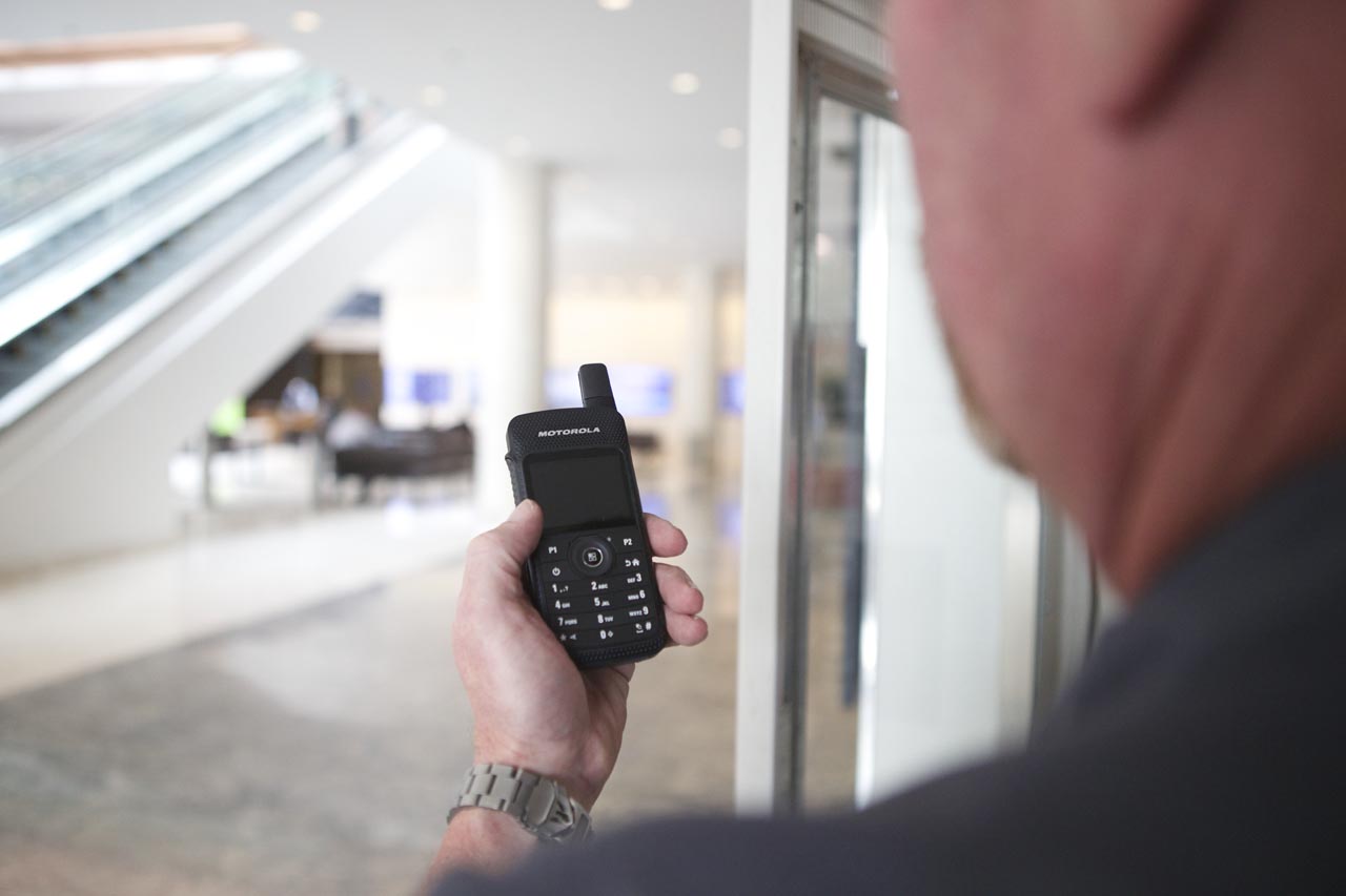 man holding a walkie talkie