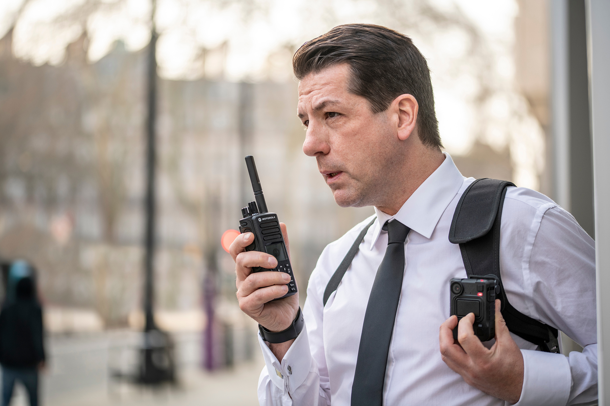 security guard holding a walkie talkie