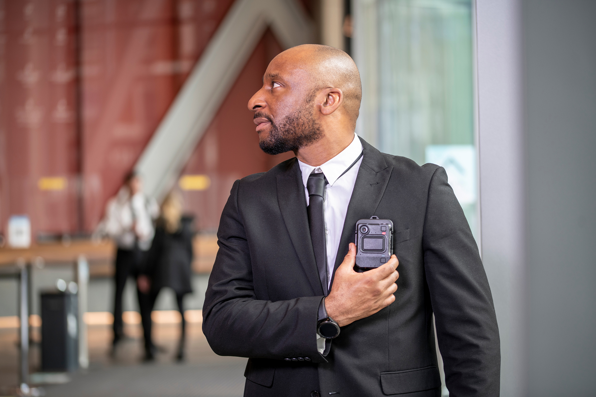 security guard holding a walkie talkie
