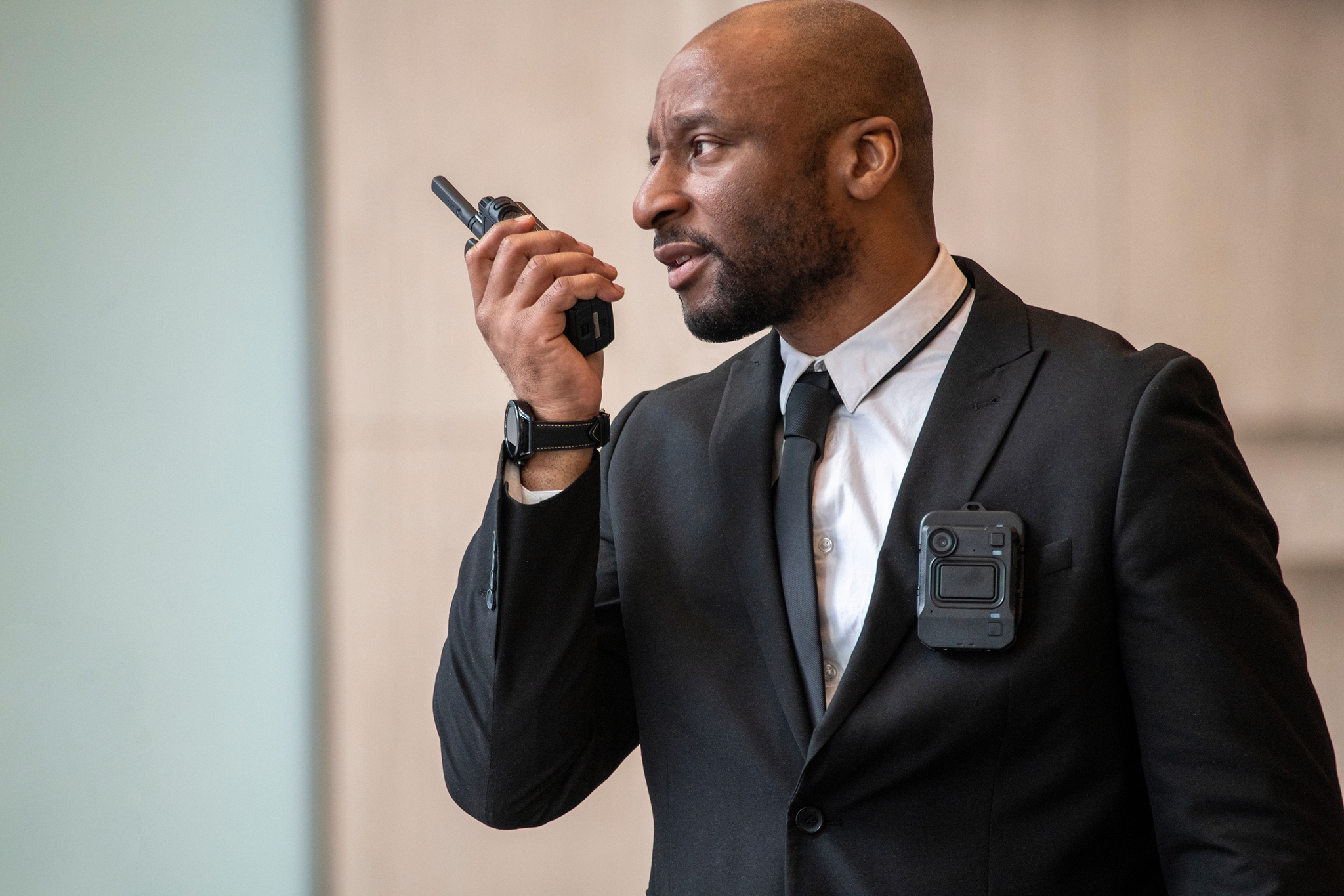 security guard holding a walkie talkie