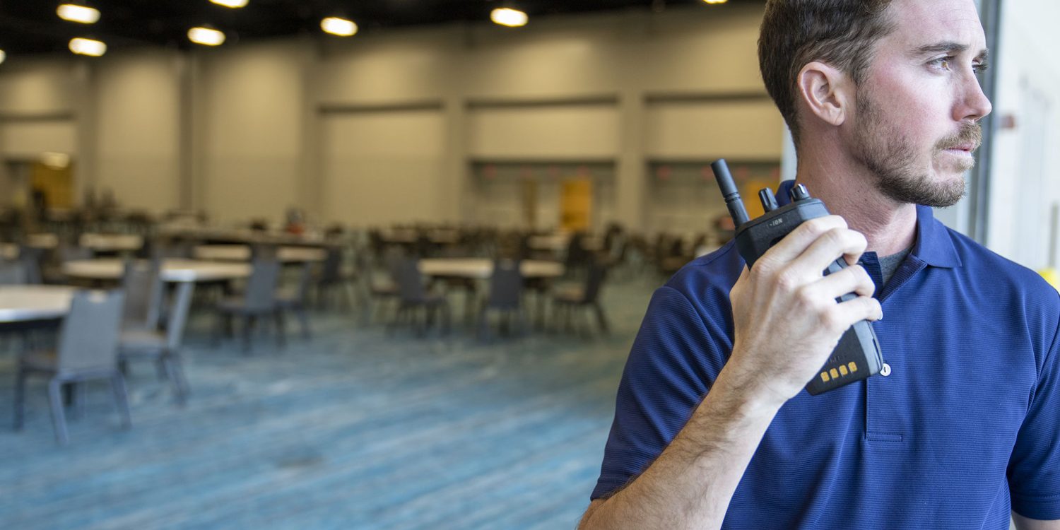 man holding a walkie talkie