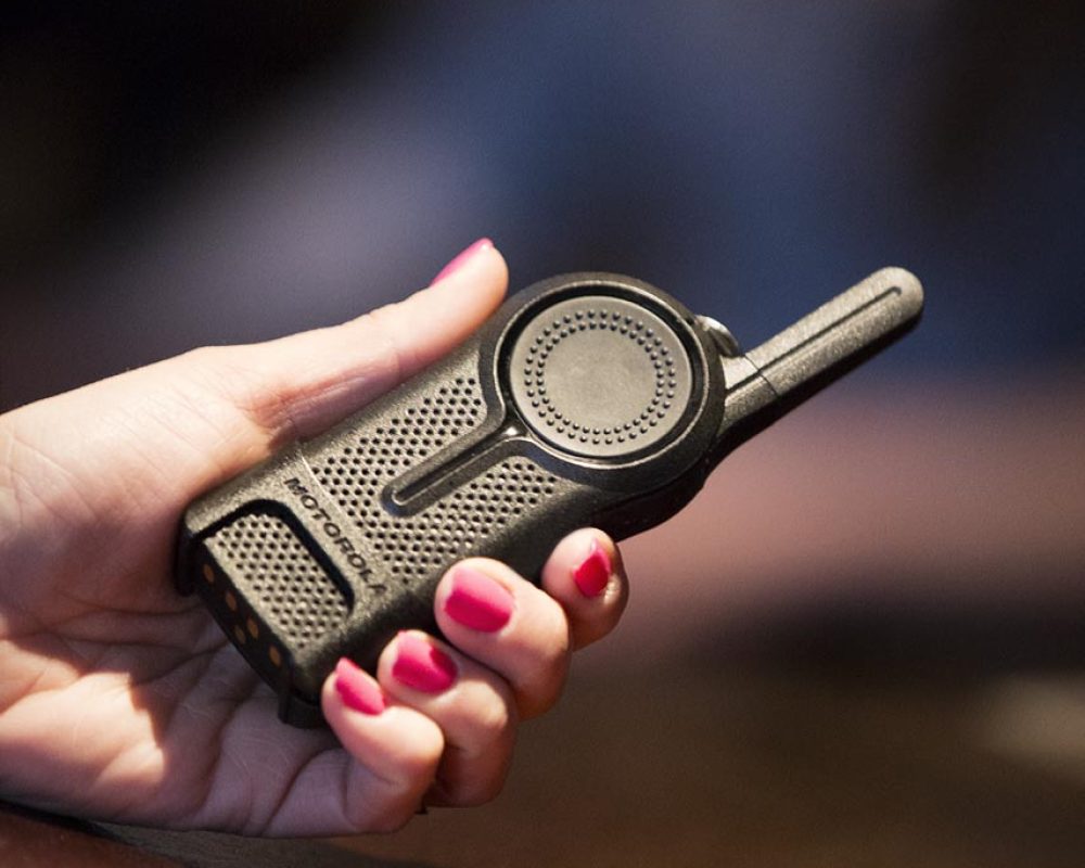 hand holding a walkie talkie